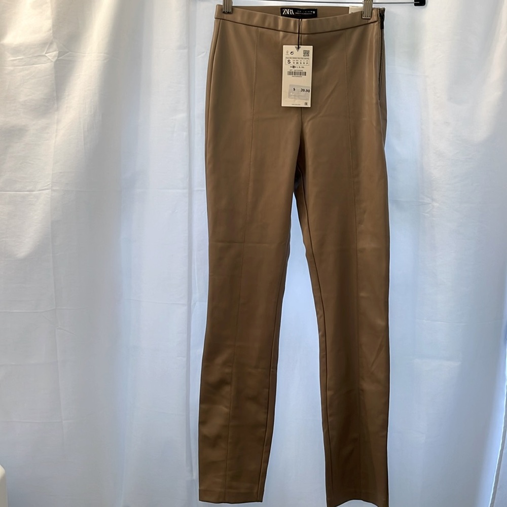 Beautiful faux leather leggings from Zara. Side zip, slits back of ankle.